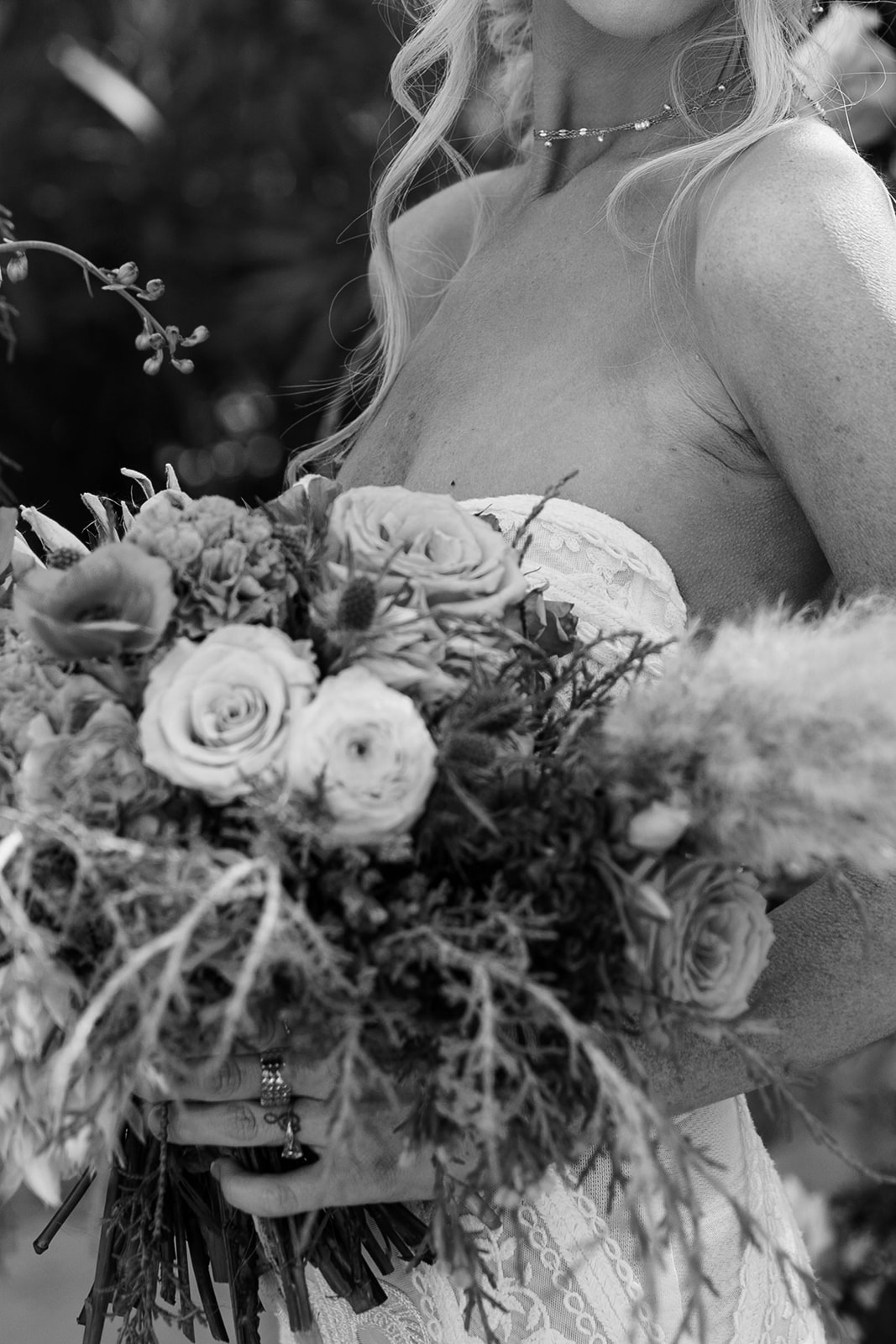 black and white photo of woman in wedding dress holding wedding bouquet for elopement ceremony, austin elopement photographer
