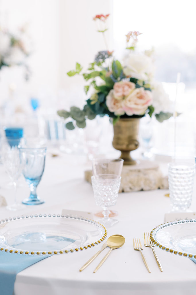 Simple clear and blue details for wedding reception table decor.