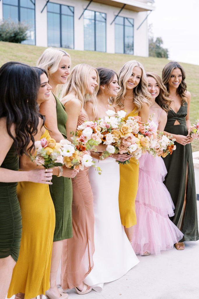 bride and bridesmaid photos outside with colorful bridesmaid dresses