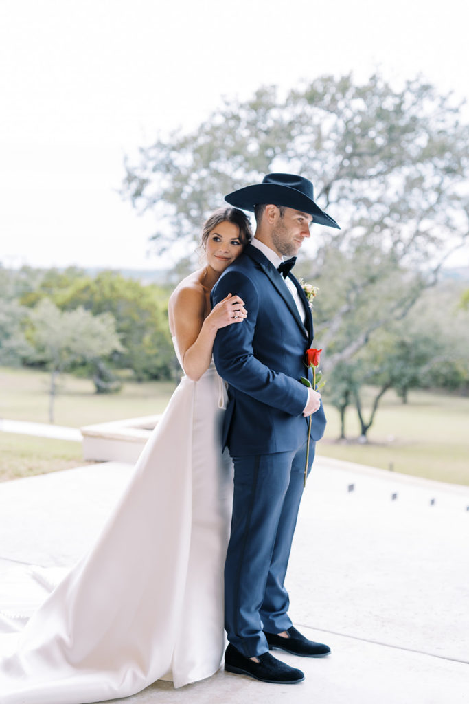 bride and groom first look pictures outside at gorgeous texas wedding venue