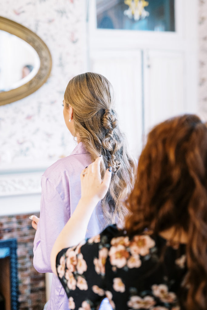 bridal party getting hair done for wedding ceremony